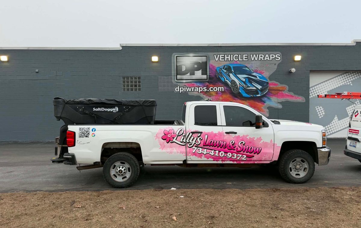 Lilly's Lawn & Snow branded truck on a job